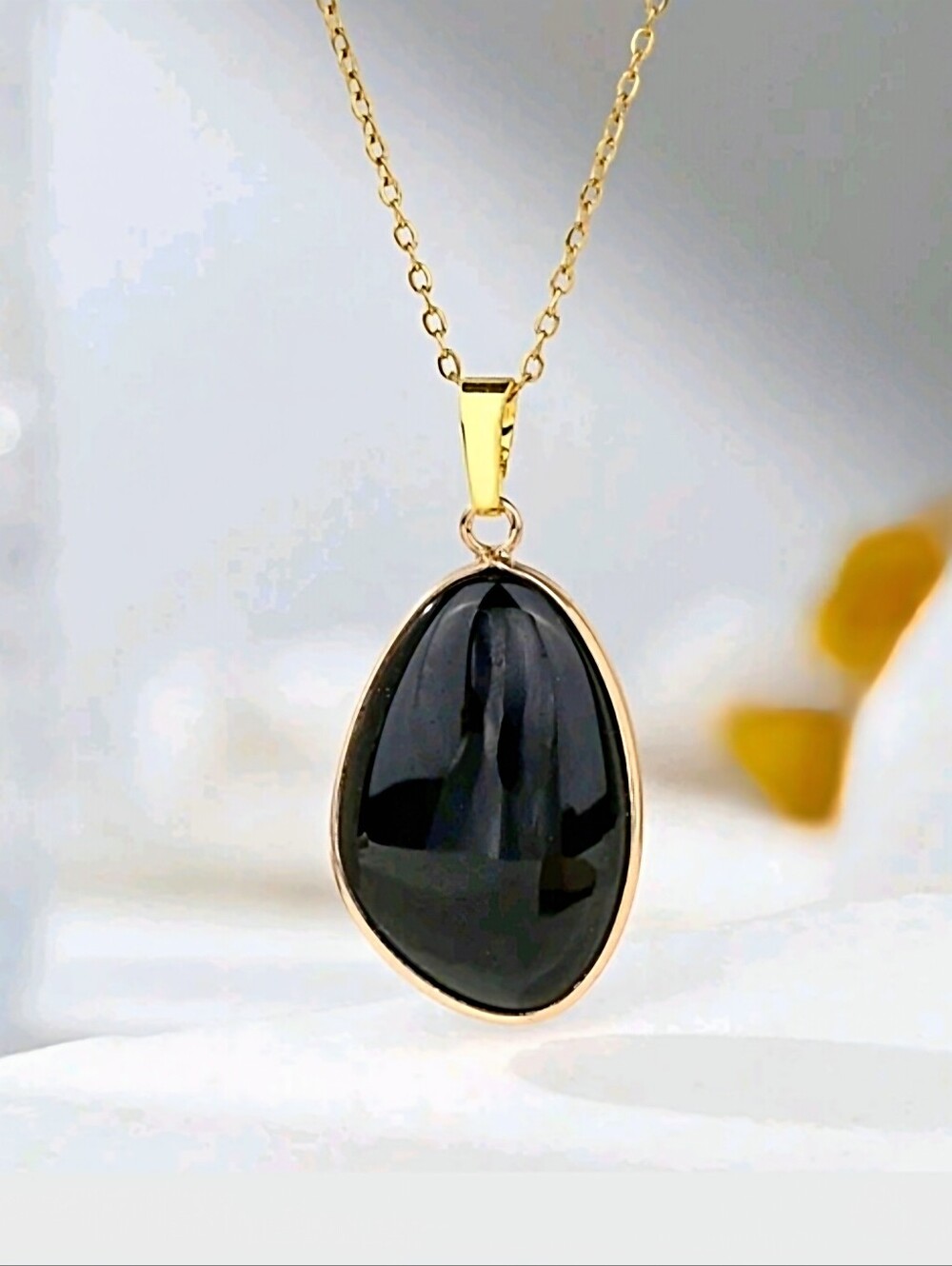 Black onyx pendant necklace. 1.6"Hx .8"W; 17.3" o-chain with a 2" extender; nwot